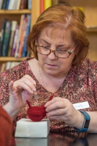 lady making cardinal